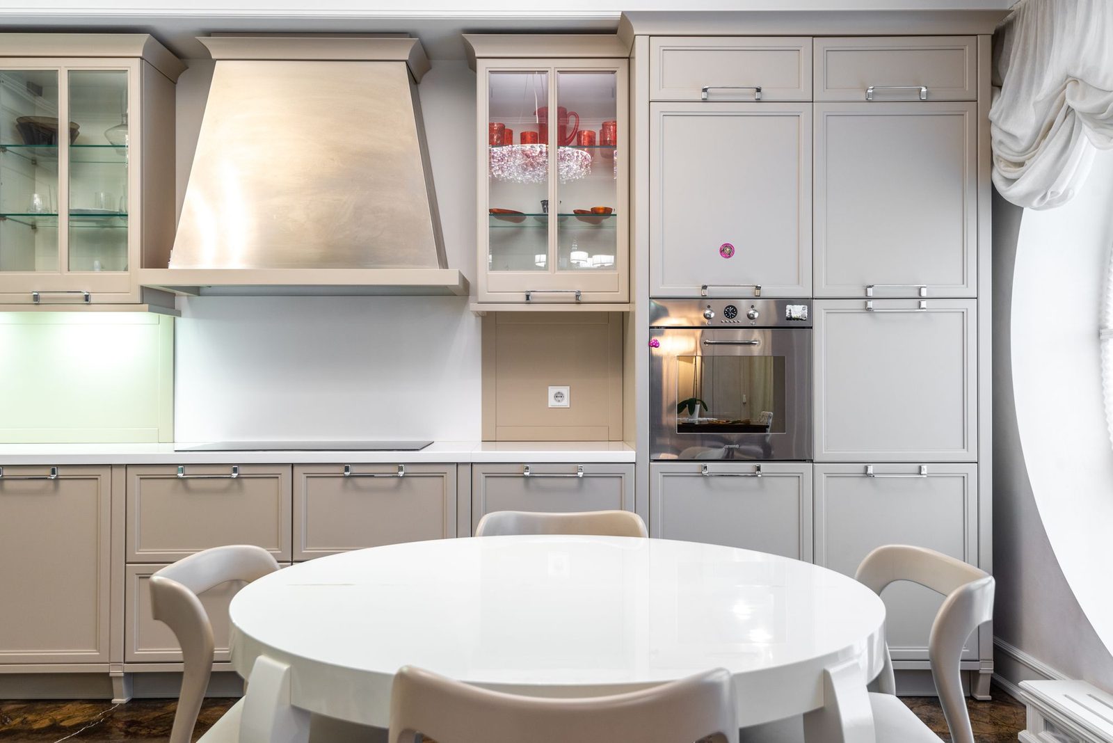 A classic cream shaker kitchen with a round dining table in a period Teesside home